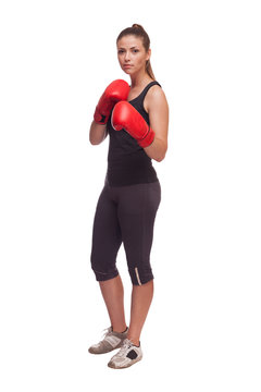 sport young woman with red gloves going to fighting