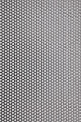 Metal surface with holes, industrial background