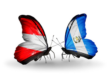 Two butterflies with flags Austria and Guatemala