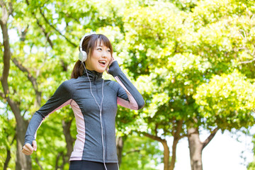 young asian woman running in the park