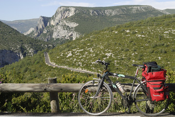 Gorges du Verdon and bicycle with red bags