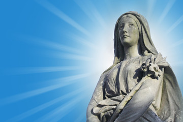 Statue of Virgin Mary in the rays of the sun