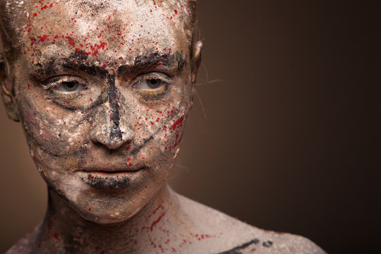 close up portrait of sad woman with face art. Scarry portrait