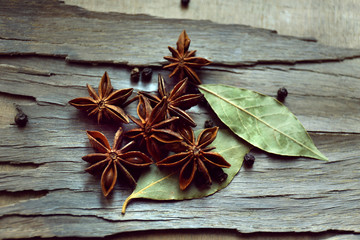 Star anise on dark wooden background, close-up