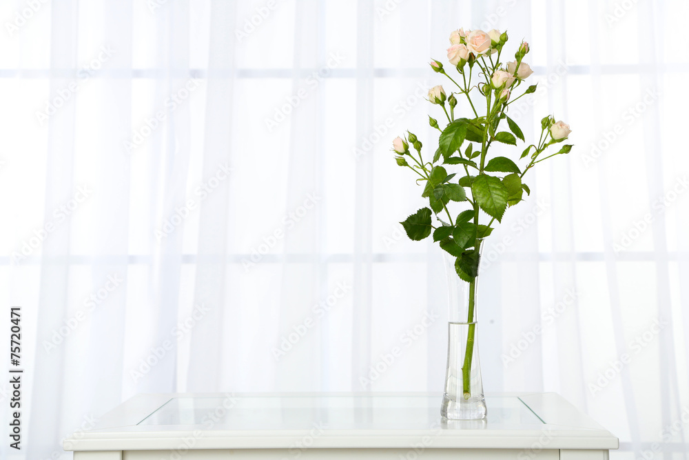 Wall mural Beautiful bouquet of flowers in vase on window background