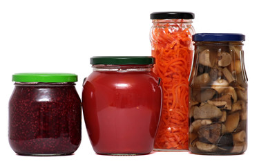 Preserved food in glass jars, isolated on white background.