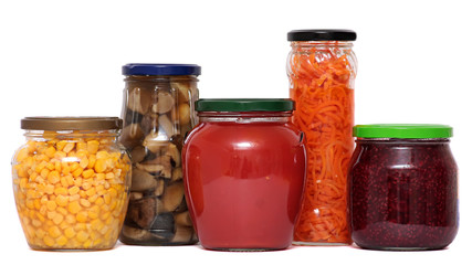 Preserved food in glass jars, isolated on white background.