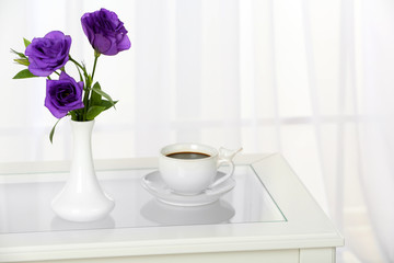 Beautiful bouquet of flowers in vase on window background