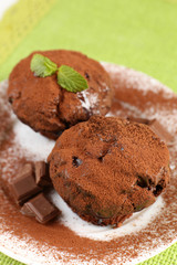 Yummy chocolate cupcake on table