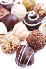 Assortment of chocolates on white background