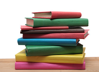 Books on wooden shelf close-up isolated white background. No