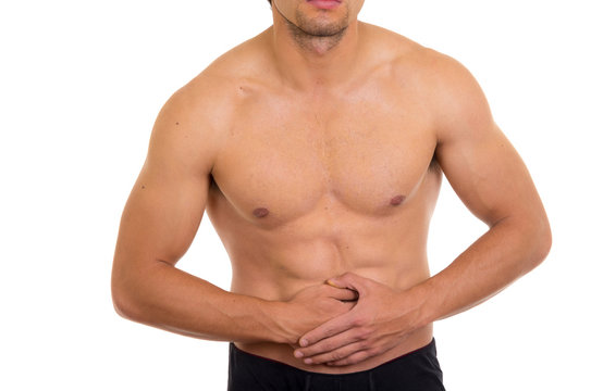 muscular shirtless man with stomach pain