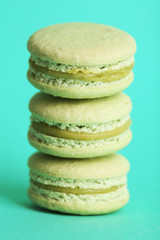 Gentle colorful macaroons on color background