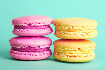 Gentle colorful macaroons on color background