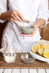 Beautician makes cosmetic facial masks, close-up,