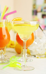 Glasses of fruit cocktails in party close-up