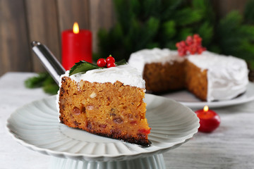 Slice of cake covered cream with Christmas decoration