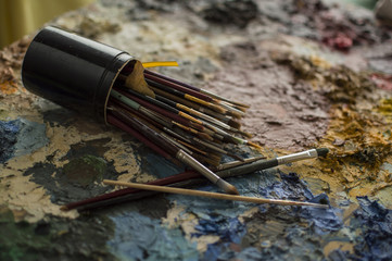 Brushes for painting on palette of dry oil colors