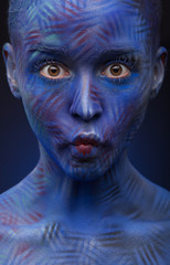 art photo of a beautiful woman with blue face