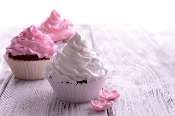 Delicious cupcakes on table close-up