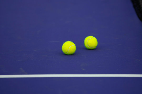 tennis ball on blue court, sport background