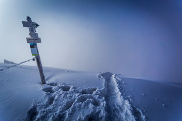 Signpost on a mountain top in winter