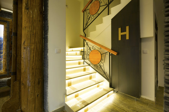 Illuminated Stairs In Empty Corridor 