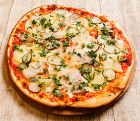 pizza on the wood background