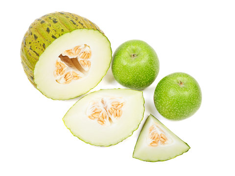 Sliced melon and green apples isolated on white background.