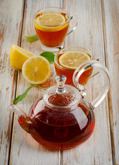 Healthy hot  tea and lemon on  a wooden table
