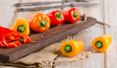Fresh peppers on a  wooden table