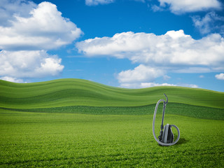 Staubsauger auf einer Wiese