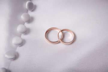 Two weddings rings on a background a fabric