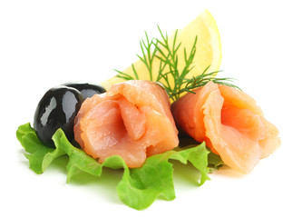 Sliced and rolled salmon, black olive and herbs isolated