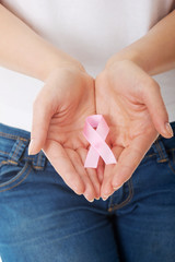 Hands holding pink breast cancer awareness ribbon