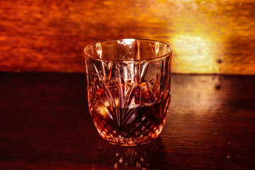 Whiskey drink on wooden table
