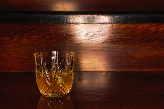 Whiskey drink on wooden table