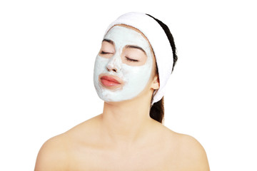 Relaxed woman with a nourishing face mask