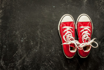 Red sneakers on black chalkboard - sports