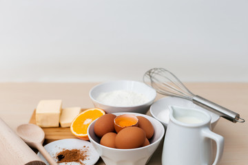 Bake ingredients top view on wooden board