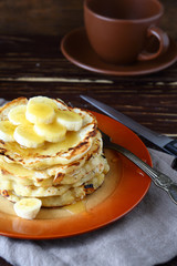 Delicious pancakes with honey and bananas