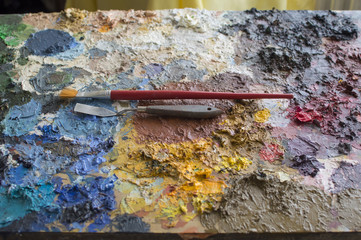 Little trowel and brush on oil colors palette