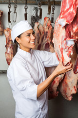 Butcher Checking Quality Of Meat