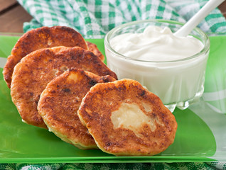 Cottage cheese pancakes on green plate