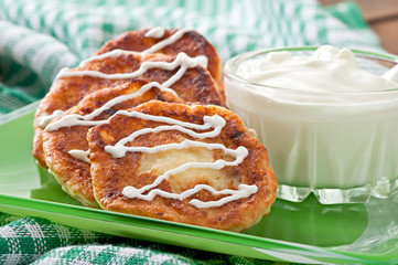 Cottage cheese pancakes on green plate