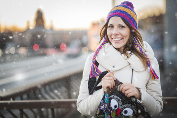 Winter woman with colorfull hat in city - 75762495