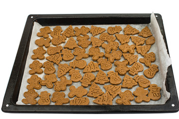 Gingerbread dough for Christmas cookies and cookie cutters.