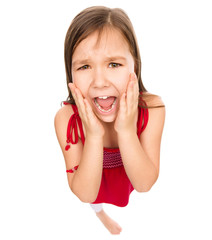 Fototapeta premium Little girl is holding her face in astonishment