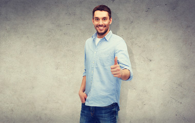 smiling man showing thumbs up