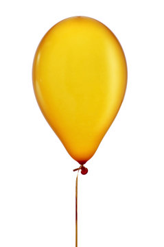 inflated golden balloon in a string